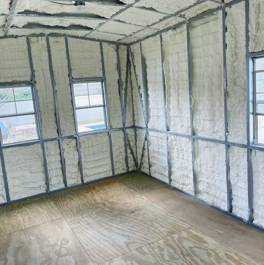 Closed-cell spray foam insulation applied to wall cavities in a residential project in Erie